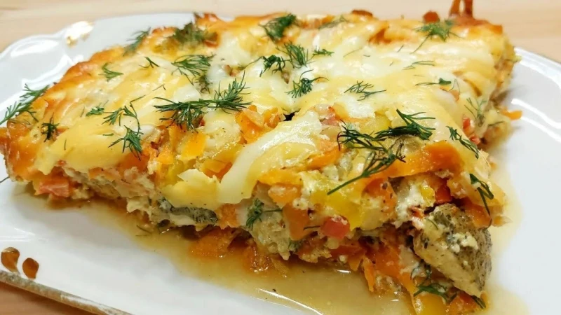 Минтай запечёный с овощами под сыром 100гр.