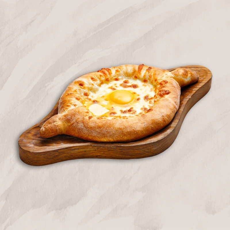 Хачапури по-аджарски с фаршем и шпинатом.