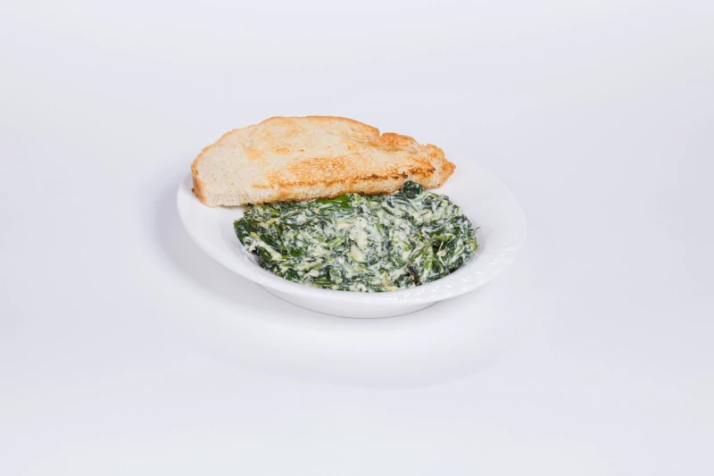 Шпинат тушёный с вялеными томатами